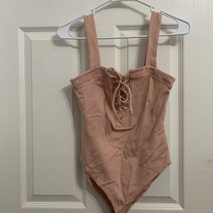 Pink body suit